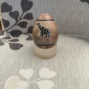 Hand carved soap stone. Design giraffe on both sides. 3 1/2 inches tall.